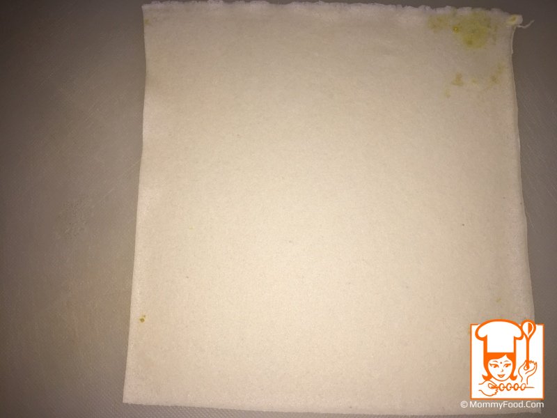 Placing filling on spring roll sheet