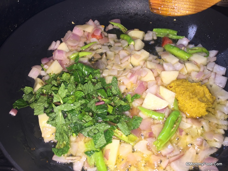 Adding Ginger Garlic Paste and Mint Leaves