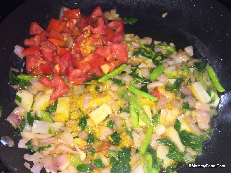 Tomatoes added to the pan