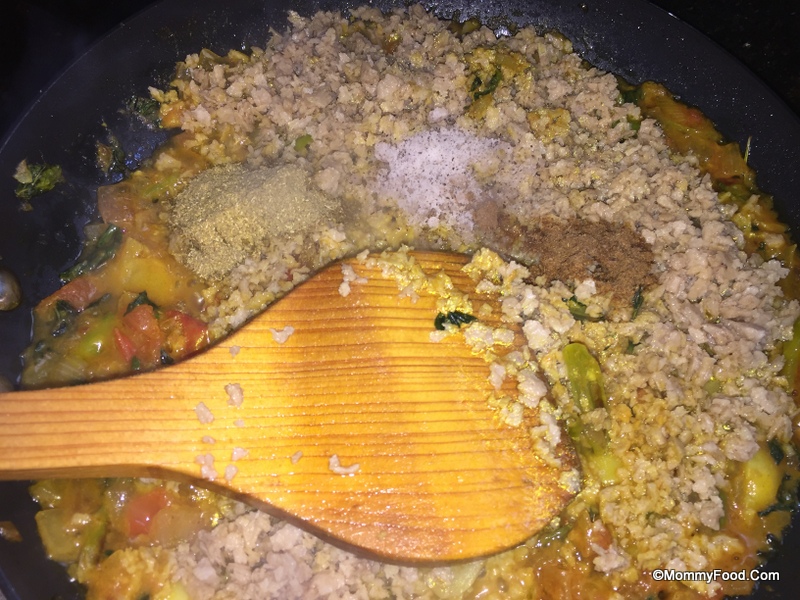 Adding spices to the curry