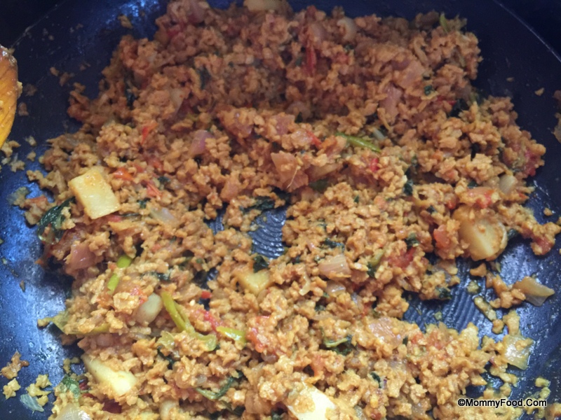Garnishing the Mealmaker Kheema Curry