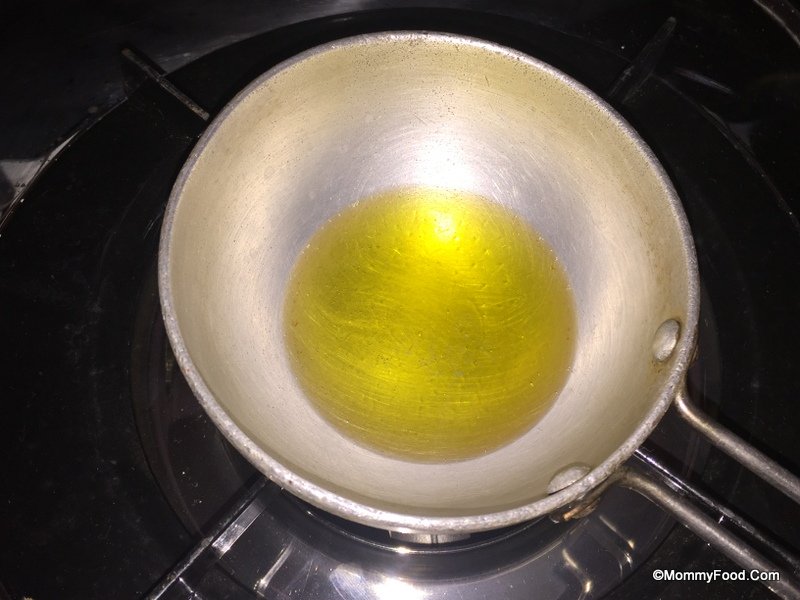 Heating ghee in a pan for tempering