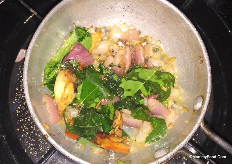 Chopped onions added to the tempering for extra flavor