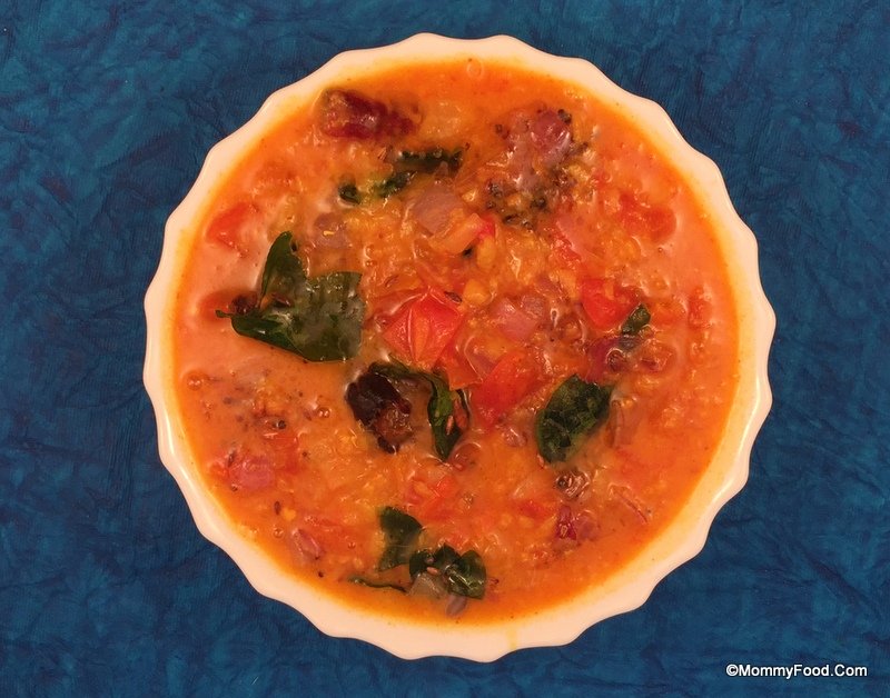 Tomato pappu served with rice and papad