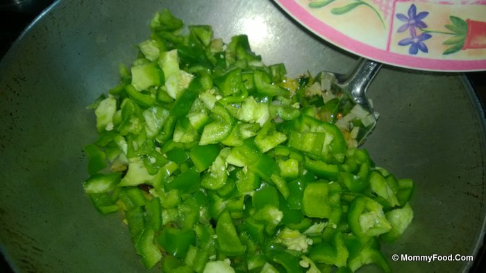 Adding capsicum to the curry