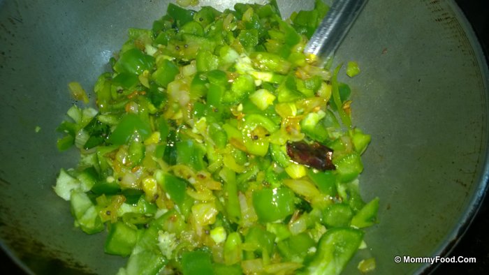 Cooking capsicum in the pan