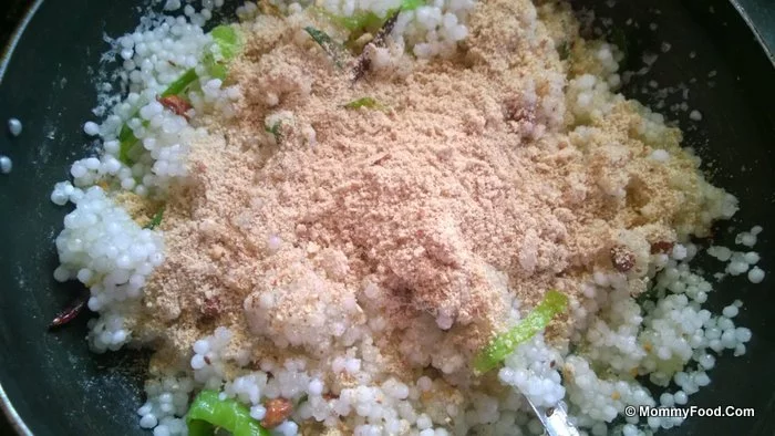 Mixing ground nut powder into Kichidi