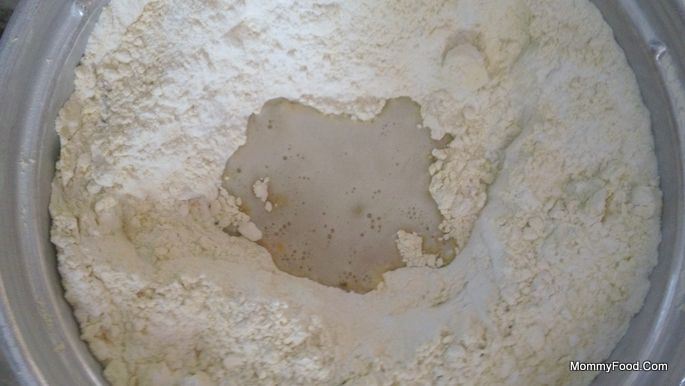 Adding butter to the flour mixture for Kaaram Poosa