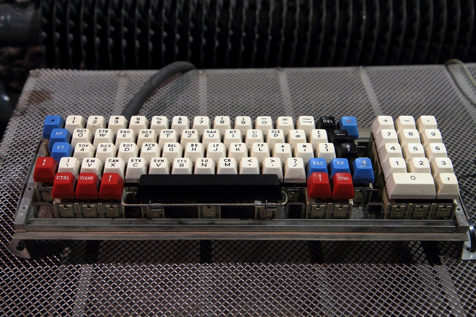 A close-up image of a mechanical keyboard showcasing its physical switches and colorful keycaps, highlighting its robust design and individual key mechanisms.