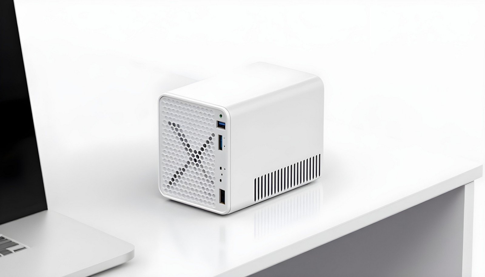 A sleek and compact Small Form Factor (SFF) case in a minimalist white design, positioned on a desk next to a laptop, showcasing efficient use of space and modern aesthetics.